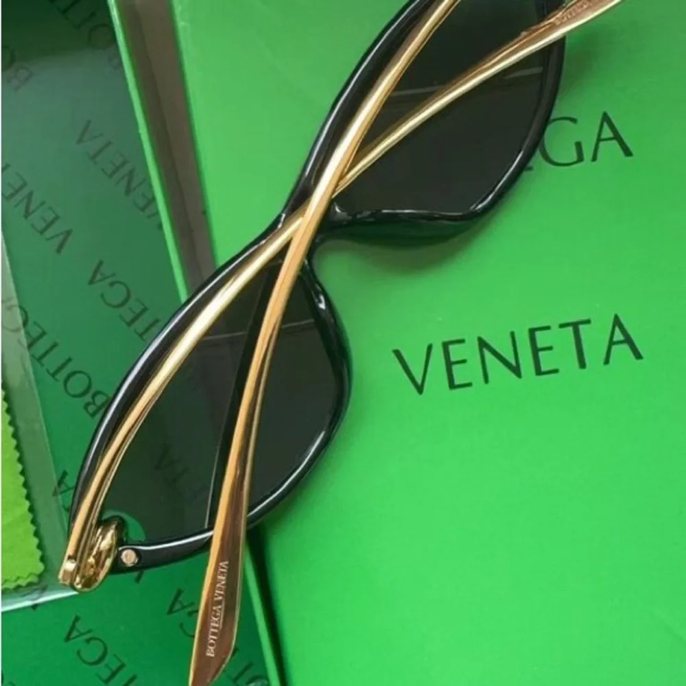 Bottega Veneta Black Frame Sunglasses with Amber Lenses and Gold Details